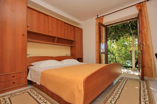 Postel nebo postele na pokoji v ubytování Apartments Drušković