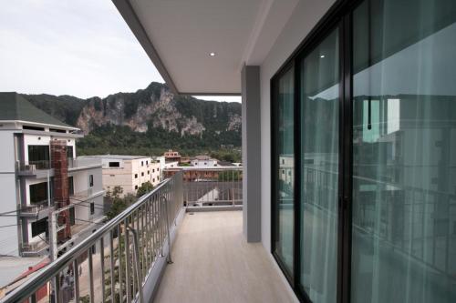 an apartment balcony with a view of the mountains at Aonang Sea Valley Resort in Ao Nang Beach