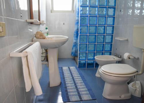a bathroom with a sink and a toilet at Casa Giuliana in Lipari