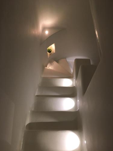 a set of stairs with lights on them at Villa Castalia by Thalassa Residence Mykonos in Elia Beach