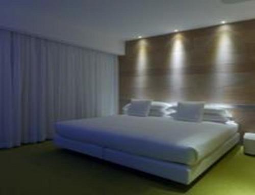 a bedroom with a large white bed in a room at A Point Arezzo Park Hotel in Arezzo