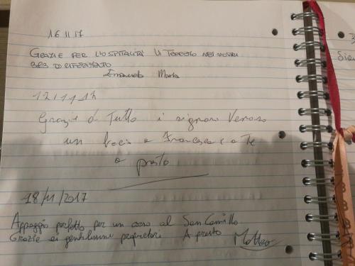 a notebook with handwriting on it at Roma Gianicolense in Rome