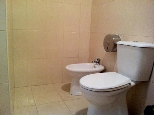 a bathroom with a toilet and a sink at Norte Guest House in Lisbon