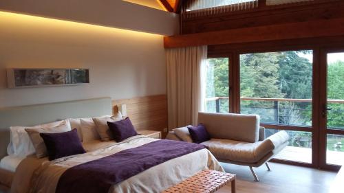 Postel nebo postele na pokoji v ubytování Hostería Huenú