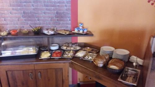 a table with a bunch of food on it at Stary Drahim in Czaplinek