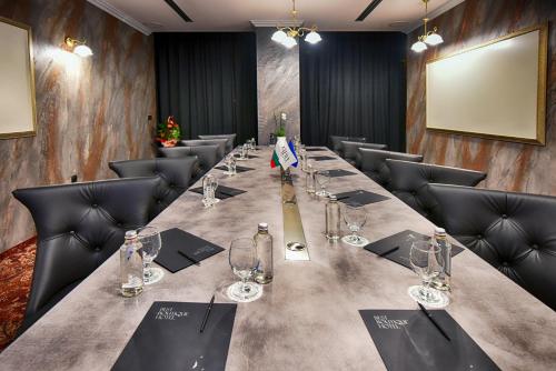 a conference room with a long table and chairs at Best Boutique Hotel in Stara Zagora