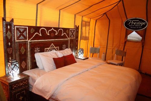 Кровать или кровати в номере Karim Sahara Prestige