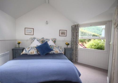 Una cama o camas en una habitación de Arrowtown Lodge