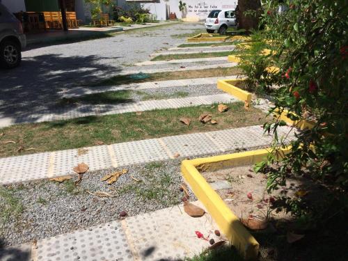 a street with a yellow curb on the side of the road at Scenarium Hotel in Recife
