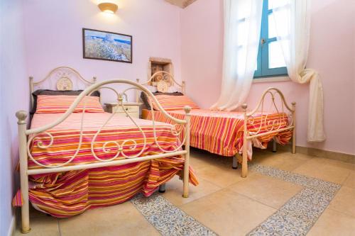Giường trong phòng chung tại Villa Astrea