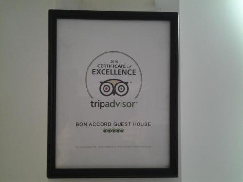 a picture of a frame with a picture of a camera at Bon Accord Mirissa in Mirissa