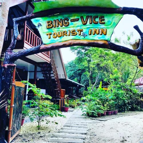 a sign for a bong vibe yourself inn at BING-VICE Tourist Inn in San Vicente