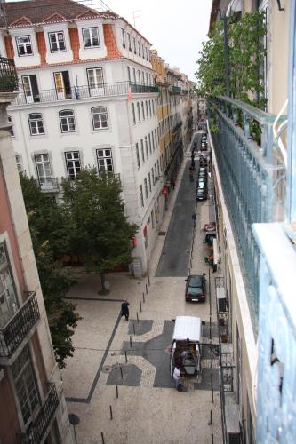 an overhead view of a city street with cars and buildings at Norte Guest House in Lisbon