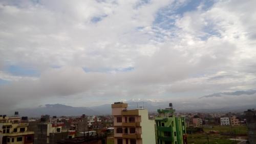 a view of a city under a cloudy sky at Everest Home Stay Apartment in Pātan
