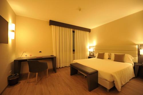 Letto o letti in una camera di Parco Hotel Sassi