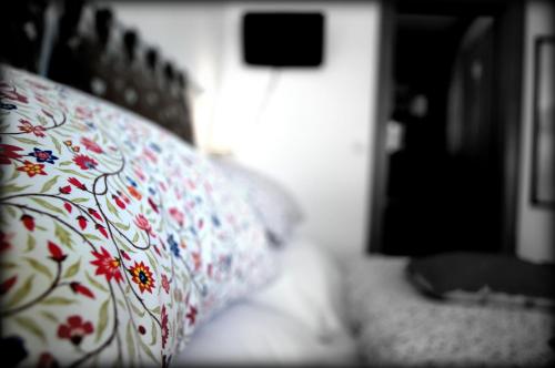 a pillow with a floral pattern on a couch at Haus Susanne in Radstadt