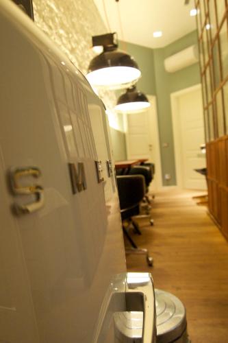 an office with a toilet in a hallway at Rooms Via Diaz in Bergamo