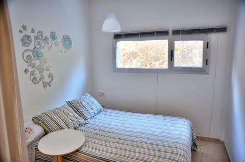 Ένα ή περισσότερα κρεβάτια σε δωμάτιο στο La Aldea