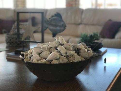 a bowl of rocks on a table in a living room at Beijo Mar Beach Club in Tibau