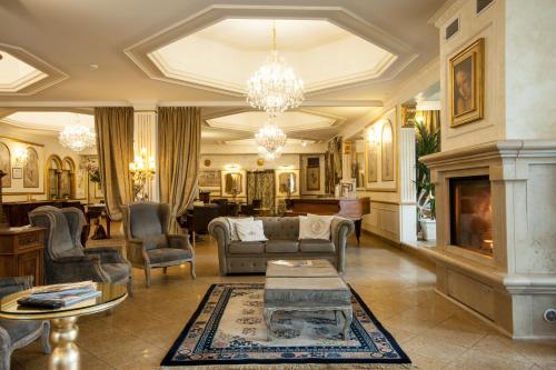 a living room filled with furniture and a fireplace at Hotel Vandelli in Pavullo nel Frignano