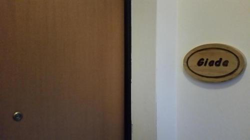 a close up of a door with a sign that reads dialect at Agriturismo Stovali Da Lustrinu in Protte