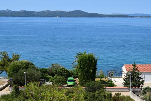 a view of a large body of water at Yellow Cube Holiday Apartments in Kožino