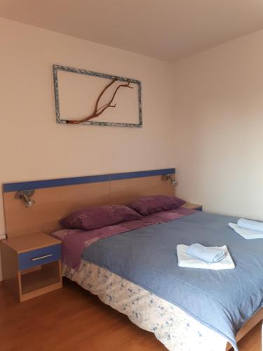 Postel nebo postele na pokoji v ubytování Apartments Bambi