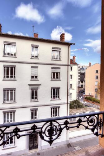 a view from a balcony of a white building at L'Appart Elegance Part Dieu in Lyon