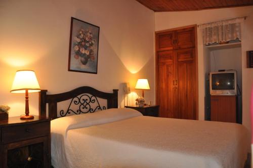 Ein Bett oder Betten in einem Zimmer der Unterkunft Finca Machangara