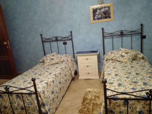 Кровать или кровати в номере Antica casa Scardone