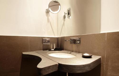 a bathroom with a sink and a mirror at Culture Hotel Centro Storico in Naples