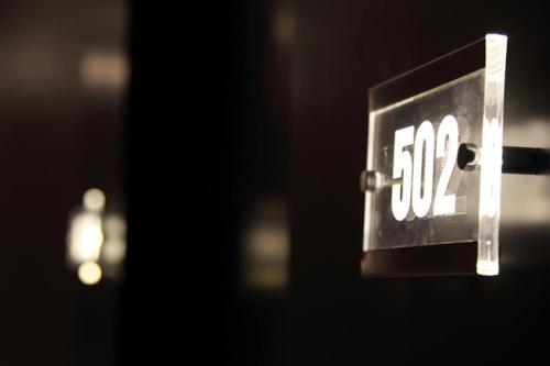 a close up of a sign with the number at Culture Hotel Centro Storico in Naples