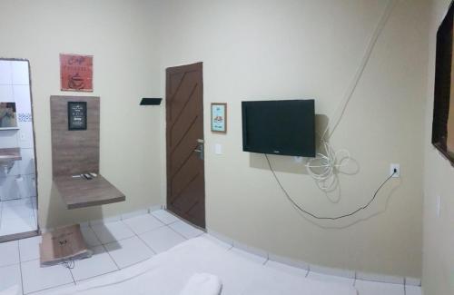 TV a/nebo společenská místnost v ubytování Residencial Candelária