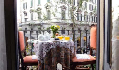 a table that has a table cloth on it at Antica Locanda Solferino in Milan