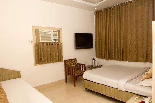 Katil atau katil-katil dalam bilik di Hotel White House