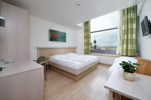Postel nebo postele na pokoji v ubytování Hotel Ankora
