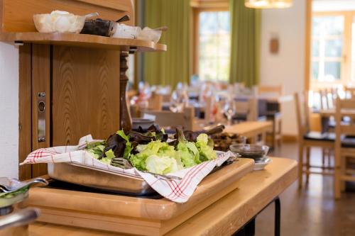 a table with a tray of food on top of it at Hotel Helvetia in Müstair