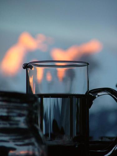 a glass cup sitting on top of a table at Hotel Ca' del Bosco in Selva di Cadore