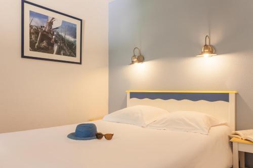 Postel nebo postele na pokoji v ubytování Résidence Pierre & Vacances Cap-Morgat
