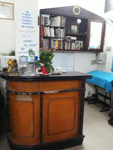 a bar in a room with a table at Giang Hotel in Ho Chi Minh City