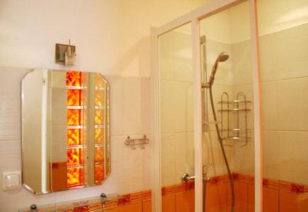a bathroom with a shower with a glass door at Vētrasputns in Mērsrags