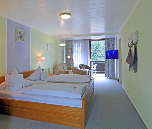 מיטה או מיטות בחדר ב-Landgasthof zur Linde