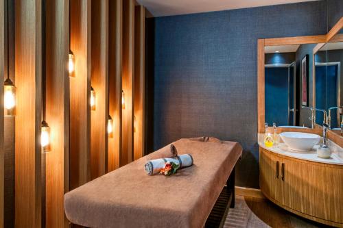a bathroom with a bath tub and a sink at Elite World Marmaris - Adult Only in Marmaris