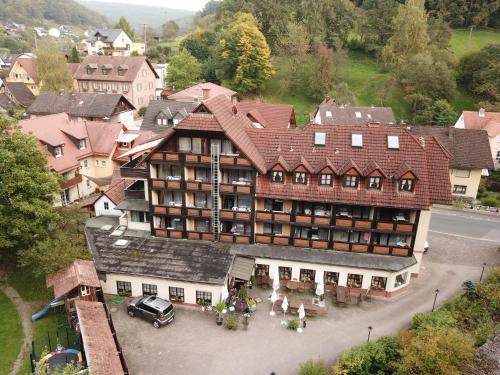 an aerial view of a large building in a town at Landgasthof zur Linde in Heimbuchenthal