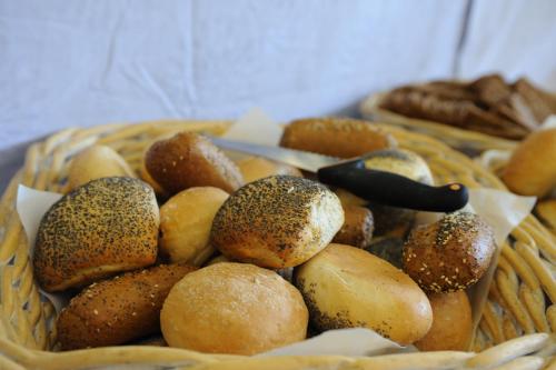 a basket filled with breads and other foods at Hotel Balka Strand in Neksø