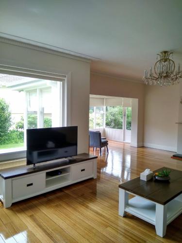 a living room with a flat screen tv at Riverbank villa in Devonport
