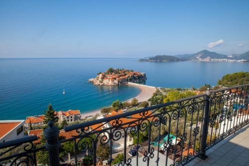 a view of the ocean from a balcony at Villa Edelweiss in Sveti Stefan