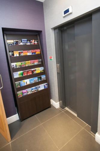a room with a refrigerator filled with food at Best Western Victoria Palace in London