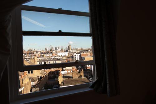a view of a city from a window at Best Western Victoria Palace in London