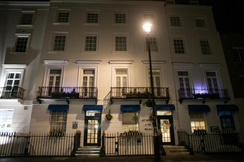 a building with a street light in front of it at Best Western Victoria Palace in London